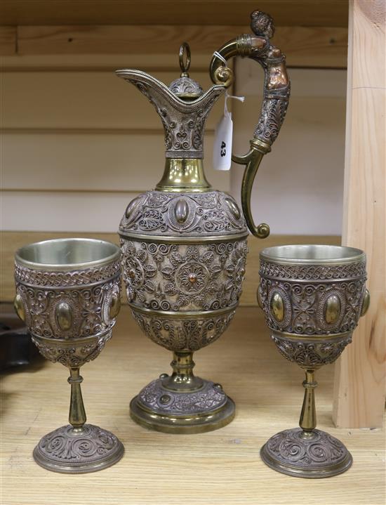 A Victorian electroplate claret jug and two goblets